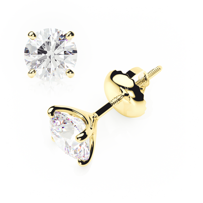 Gold stud earrings with clear gemstones on a white background