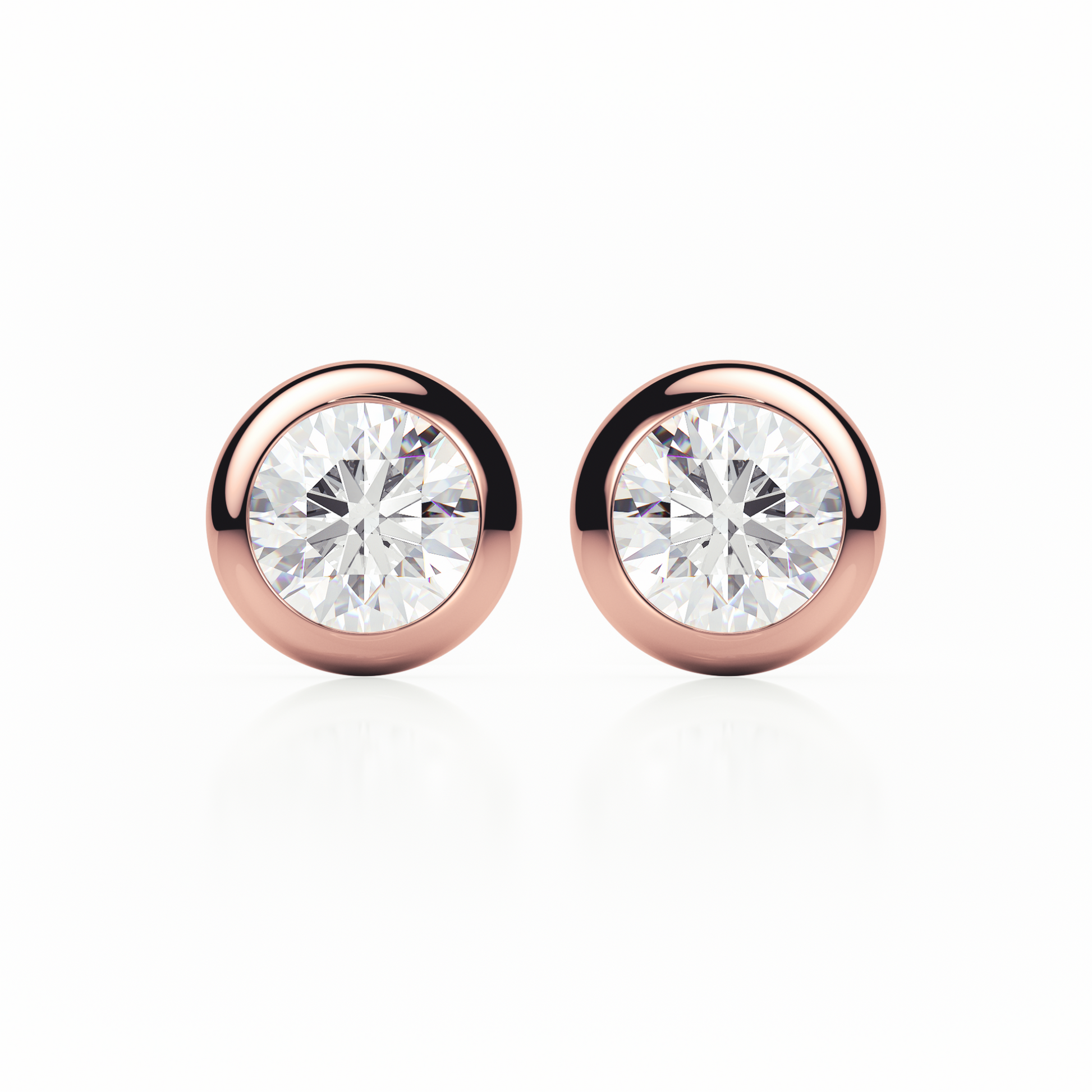 Rose gold earrings with clear gemstones on a white background