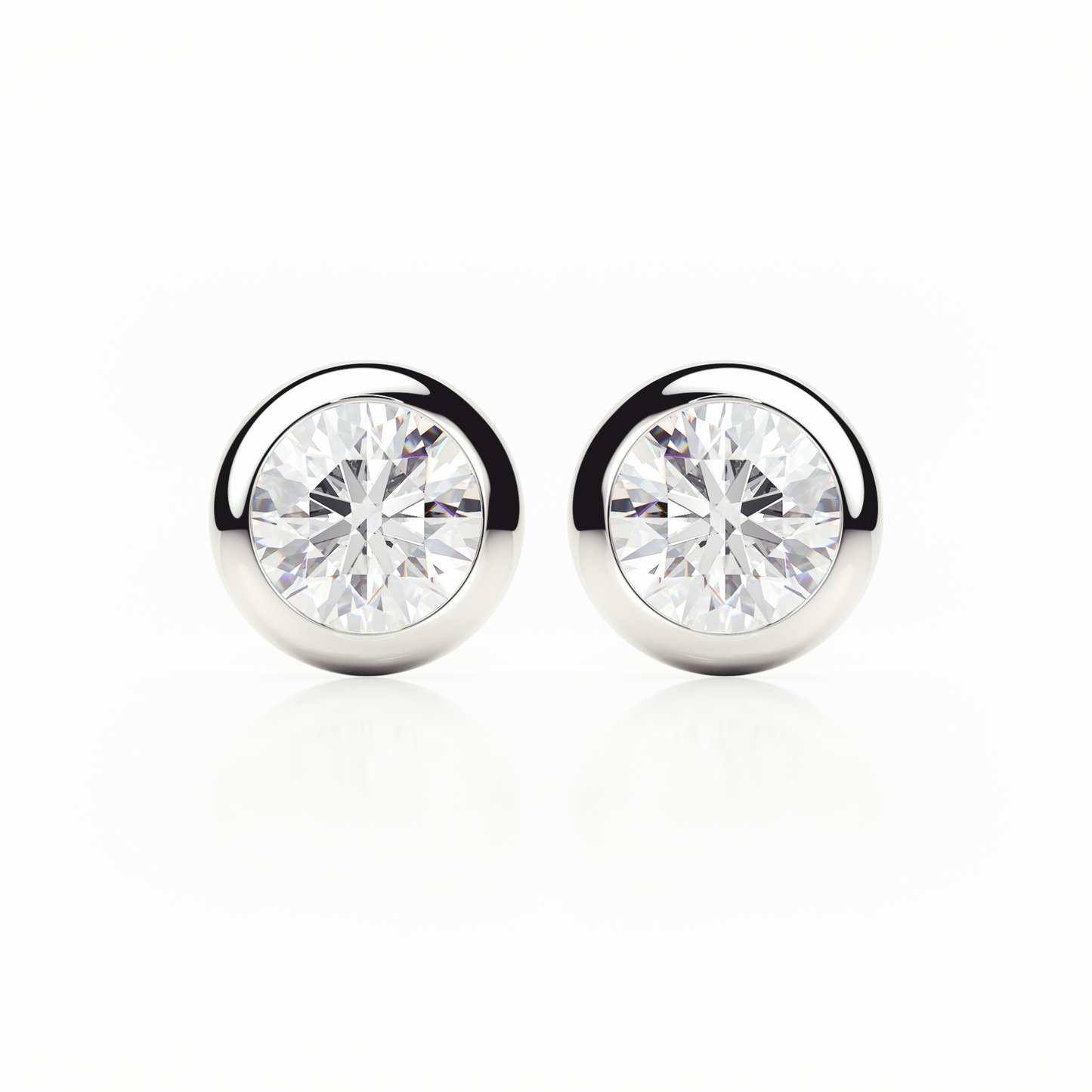 Pair of silver stud earrings with clear gemstones on a white background