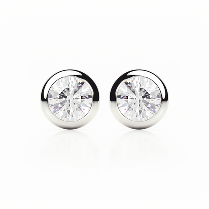 Pair of silver stud earrings with clear gemstones on a white background
