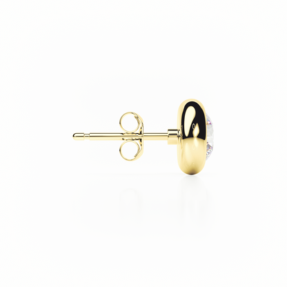 Gold earring with a clear gemstone on a white background