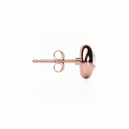 Rose gold earring on a white background