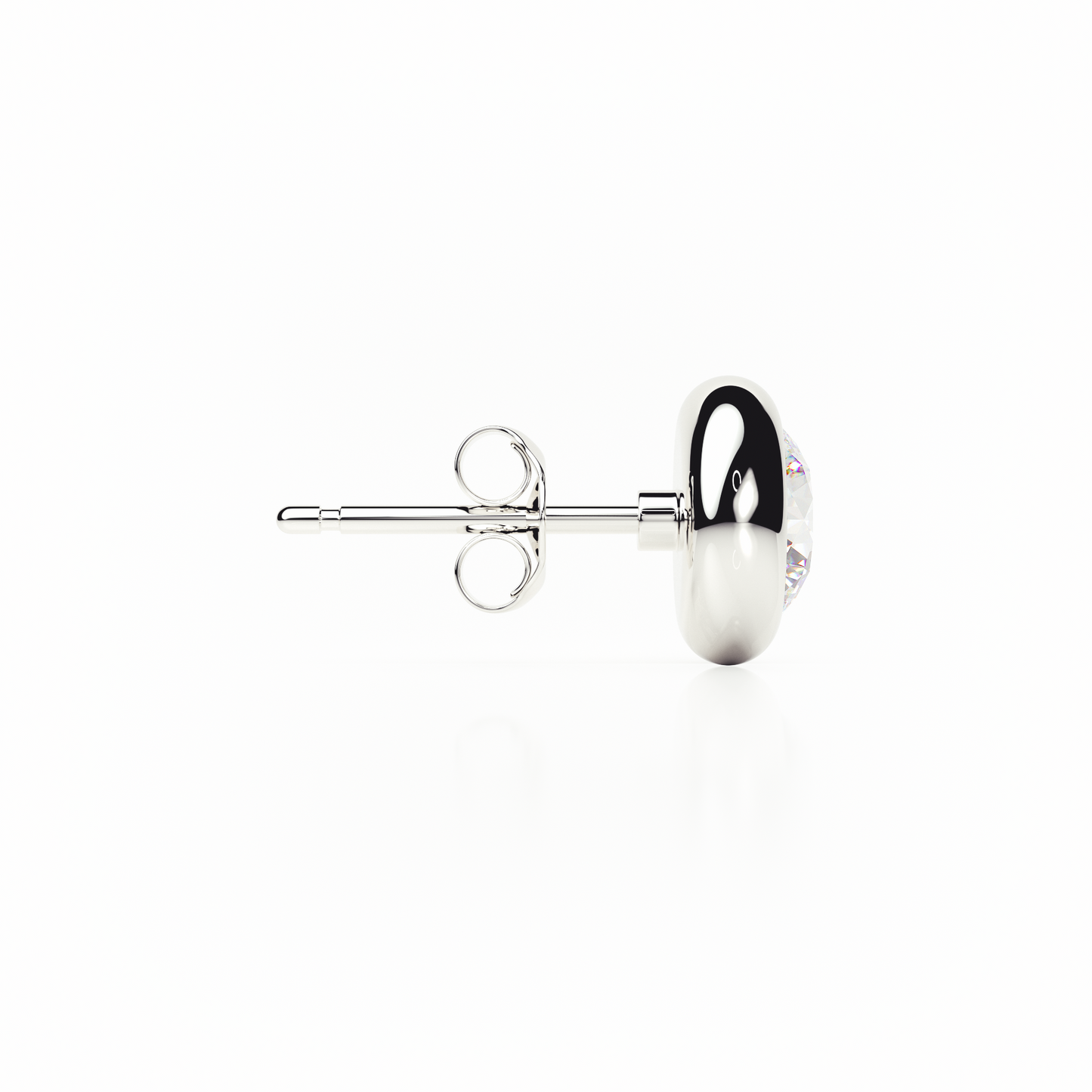 Silver earring with a clear gemstone on a white background