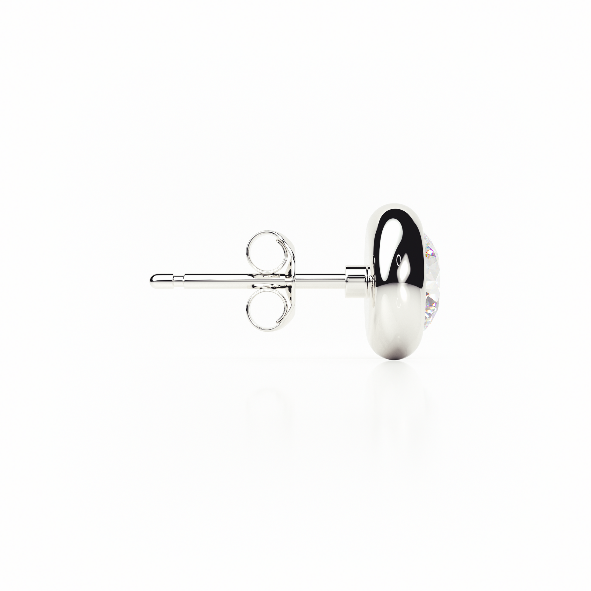 Silver earring with a clear gemstone on a white background