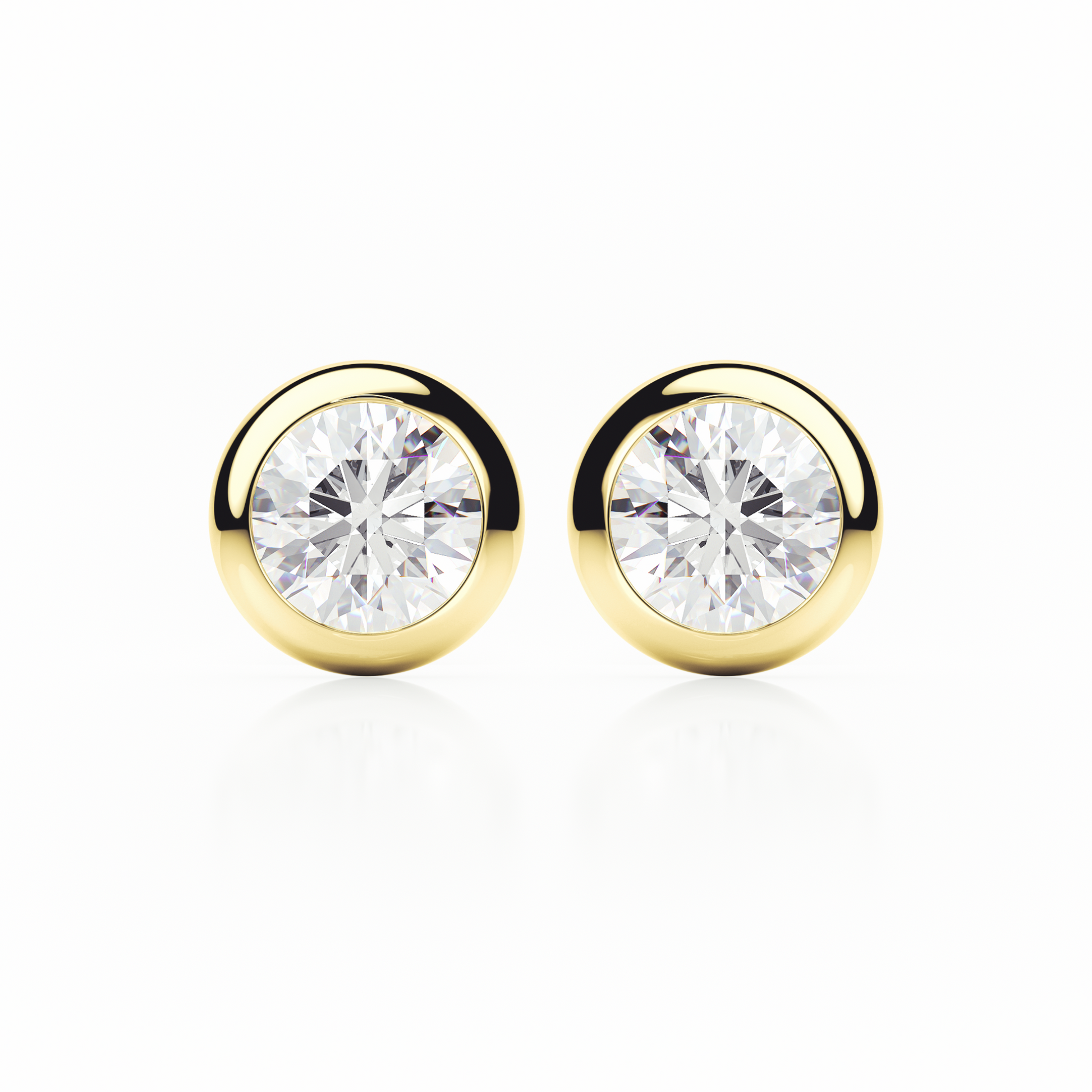 Gold earrings with clear gemstones on a white background
