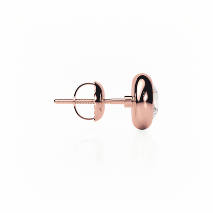 Rose gold earring on a white background