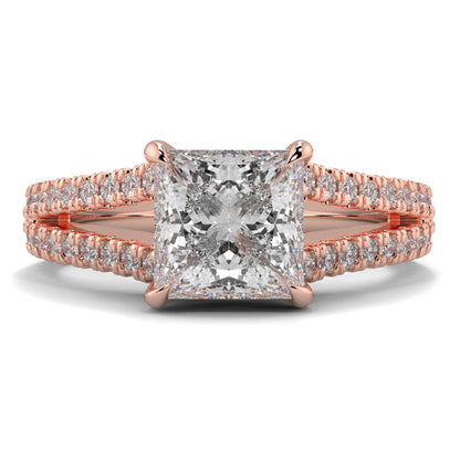 Rose gold ring with a large diamond and smaller diamonds on the band against a white background Yb jewellers engagement ring straight band