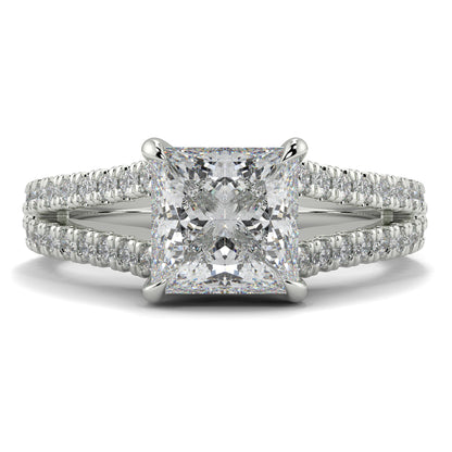 Diamond ring with a prominent central gemstone and smaller stones on a white background Yb jewellers engagement ring straight band