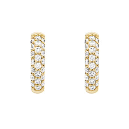 Gold hoop earrings with embedded diamonds on a green background pair of huggiee earrings in 18k white gold platinum with micro diamond setting by yb jewellers 