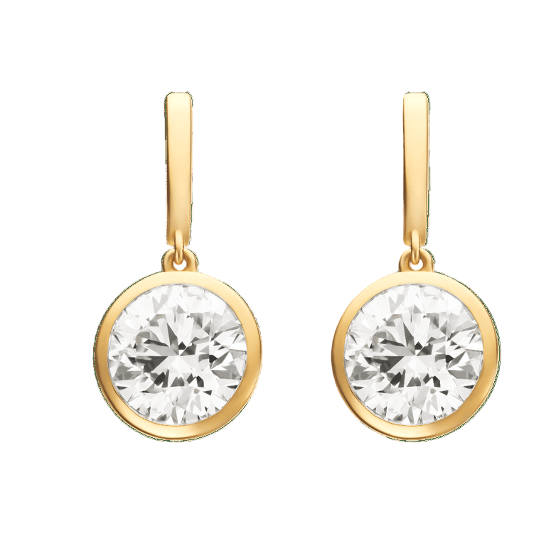 Gold earrings with clear gemstones on a green background  yb jewellers yellow gold diamond drop earrings rubover setting