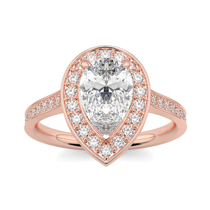 Rose gold ring with a pear-shaped diamond and smaller diamonds on a white background Pear shaped diamond engagement ring Yb jewellers trending ring designs