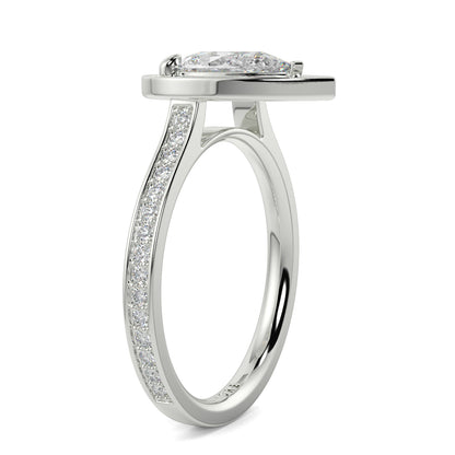 Silver ring with diamond accents on a white background Pear shaped diamond engagement ring Yb jewellers trending ring designs