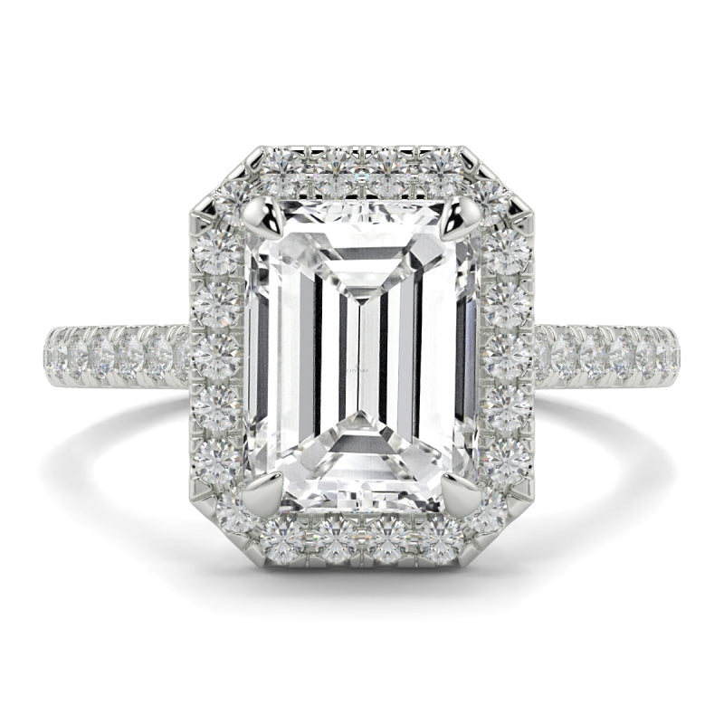 Diamond ring with emerald-cut center stone and smaller diamonds on a white background YB Jewellers Engagement Ring