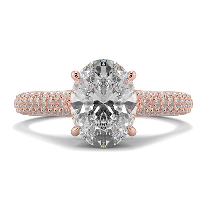 Rose gold ring with a large diamond and smaller diamonds on the band against a white background Yb jewellers engagement ring straight band