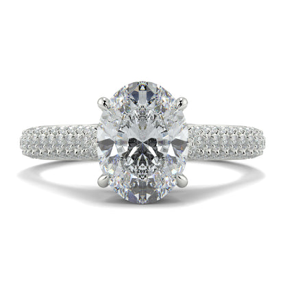 Diamond ring with two large gemstones and a smaller one on a white Yb jewellers engagement ring straight band background