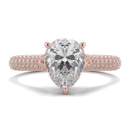 Rose gold ring with a pear-shaped diamond on a white background Yb jewellers engagement ring straight band