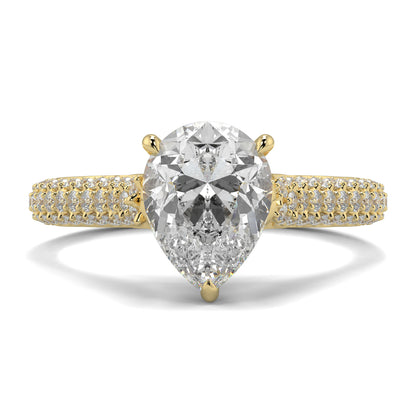 Gold ring with a pear-shaped diamond on a white background Yb jewellers engagement ring straight band