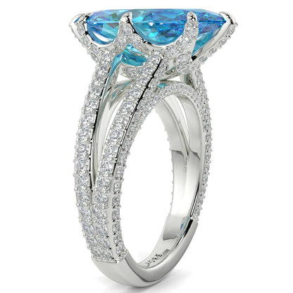 Silver ring with blue gemstones on a white background yb jewellers marquise split diamond engagement ring with diamond set band and diamond encrusted collet vintage marquise lab grown blue diamond ring
