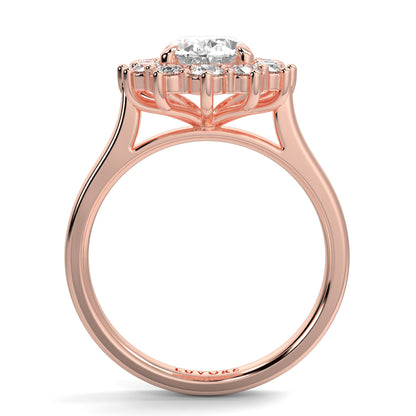 Rose gold ring with a diamond on a white background Yb jewellers engagement ring with a cluster halo and oval diamond trending design 