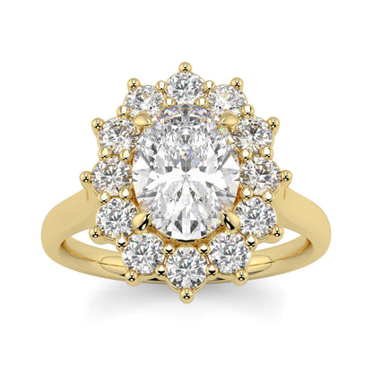 Gold ring with a large central diamond and smaller diamonds around on a white background Yb jewellers engagement ring with a cluster halo and oval diamond trending design 