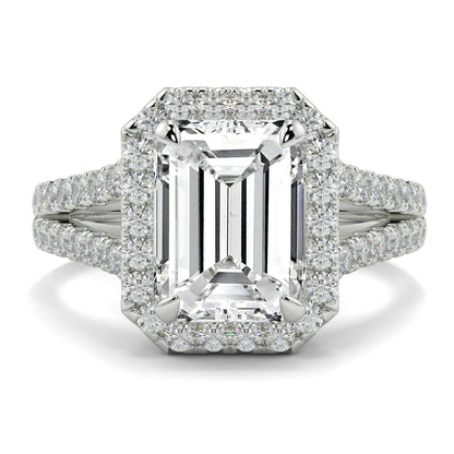 Diamond ring with emerald-cut centre stone and diamond accents on a white background Yb jewellers emerald split halo diamond engagement ring 