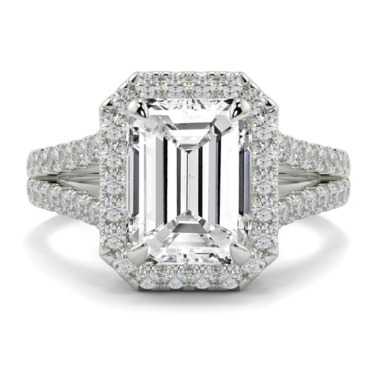 Diamond ring with emerald-cut centre stone and diamond accents on a white background Yb jewellers emerald split halo diamond engagement ring 