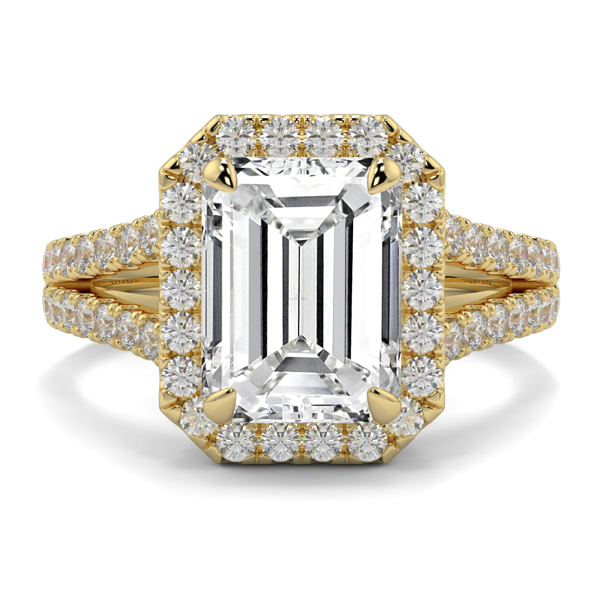 Gold ring with emerald-cut diamond and smaller diamonds on a white background Yb jewellers emerald split halo diamond engagement ring 