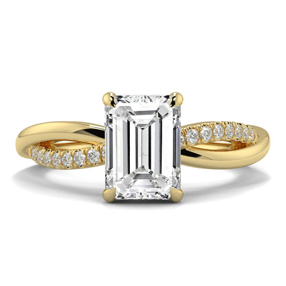 Gold ring with a large emerald-cut diamond and smaller diamonds on a white background Yb jewellers engagement ring twist band