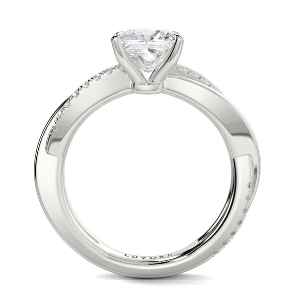 Diamond ring with a heart-shaped center stone on a white background Yb jewellers engagement ring twist band