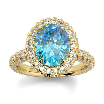 Gold ring with a blue gemstone and diamond accents on a white background oval diamond halo lab grown blue diamond engagement ring - 18k yellow gold diamond ring