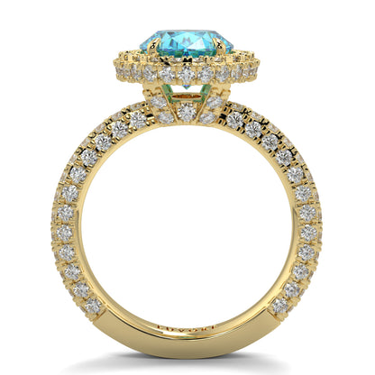 Gold ring with a blue gemstone and diamond accents on a white background oval diamond halo lab grown blue diamond engagement ring - 18k yellow gold diamond ring