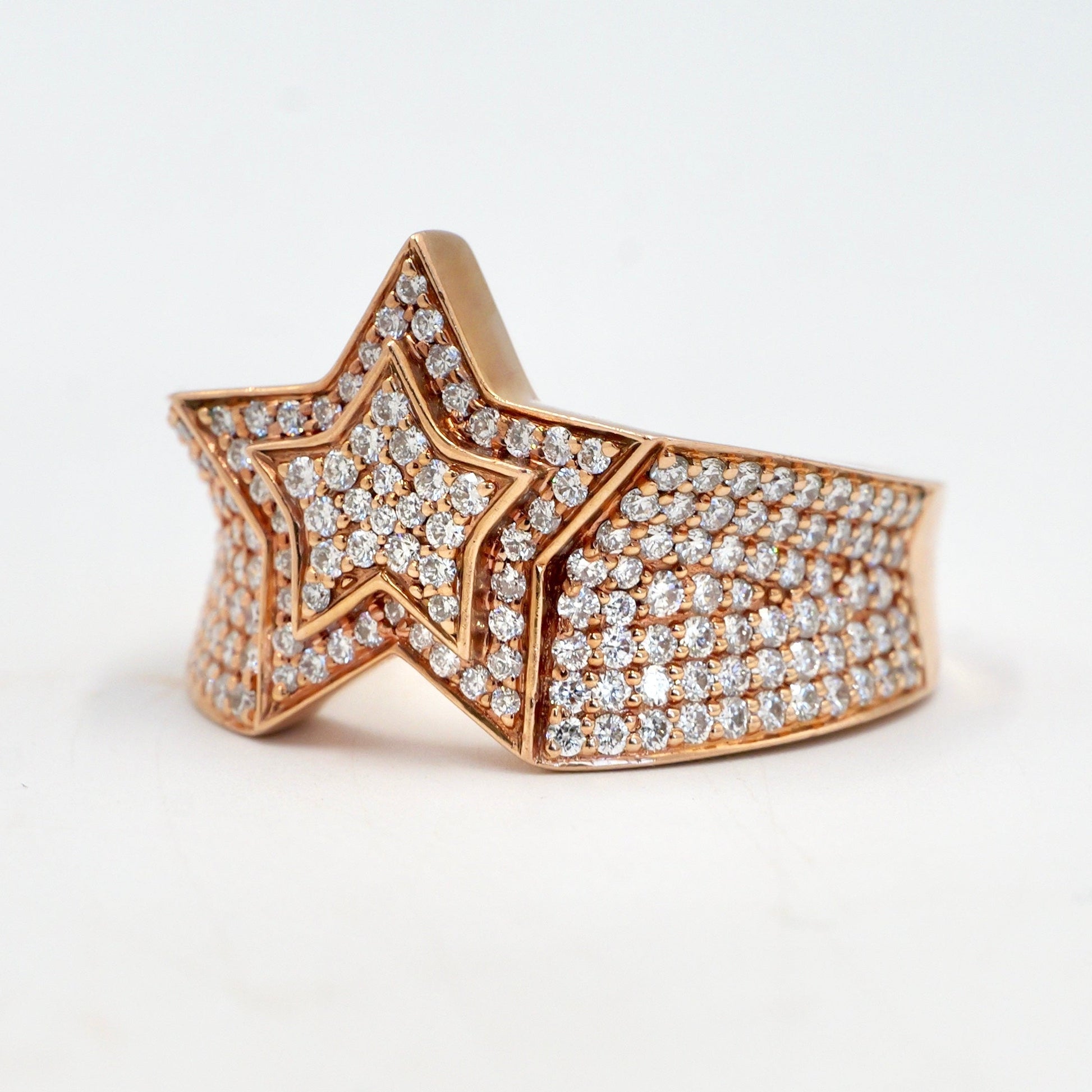 Star-shaped ring with diamond accents on a white background hip hop pinky ring rose gold diamond set yb jewellers best selling rings