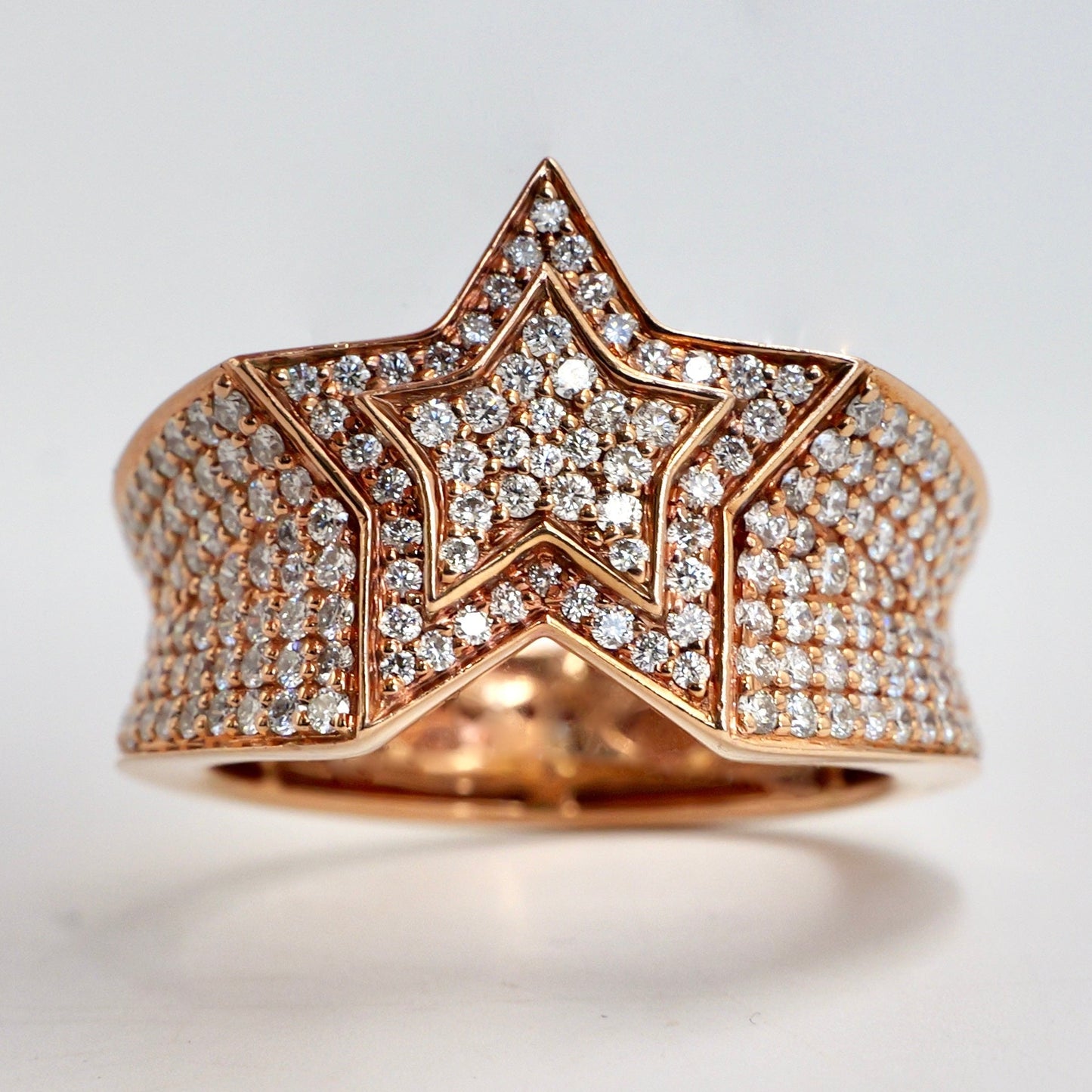 Rose gold star-shaped ring with diamond accents on a light gray background hip hop pinky ring rose gold diamond set yb jewellers best selling rings
