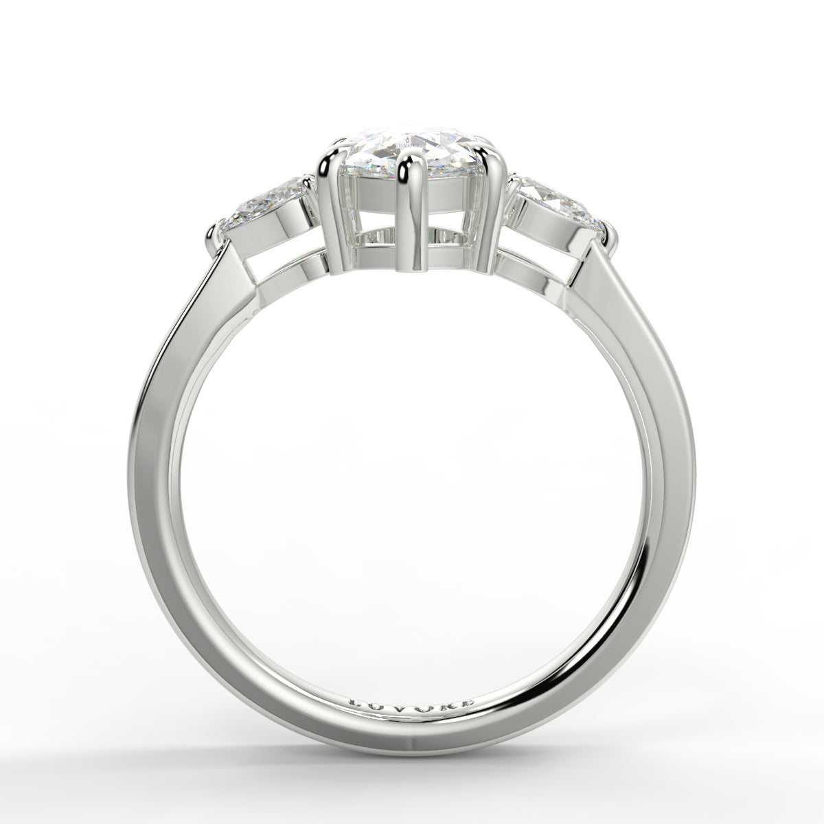 Diamond ring with a white gold band on a white background _yb_jewellers_3_stone_trilogy_engagement_ring_round_and_pear_shape_best_selling_design_trending_diamond_ring