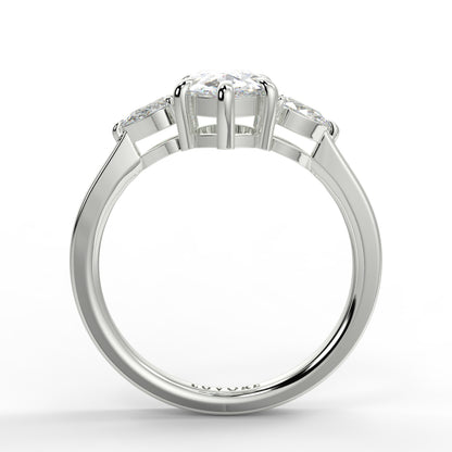 Diamond ring with a white gold band on a white background _yb_jewellers_3_stone_trilogy_engagement_ring_round_and_pear_shape_best_selling_design_trending_diamond_ring