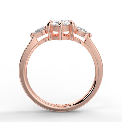 Rose gold ring with three diamonds on a white background _yb_jewellers_3_stone_trilogy_engagement_ring_round_and_pear_shape_best_selling_design_trending_diamond_ring