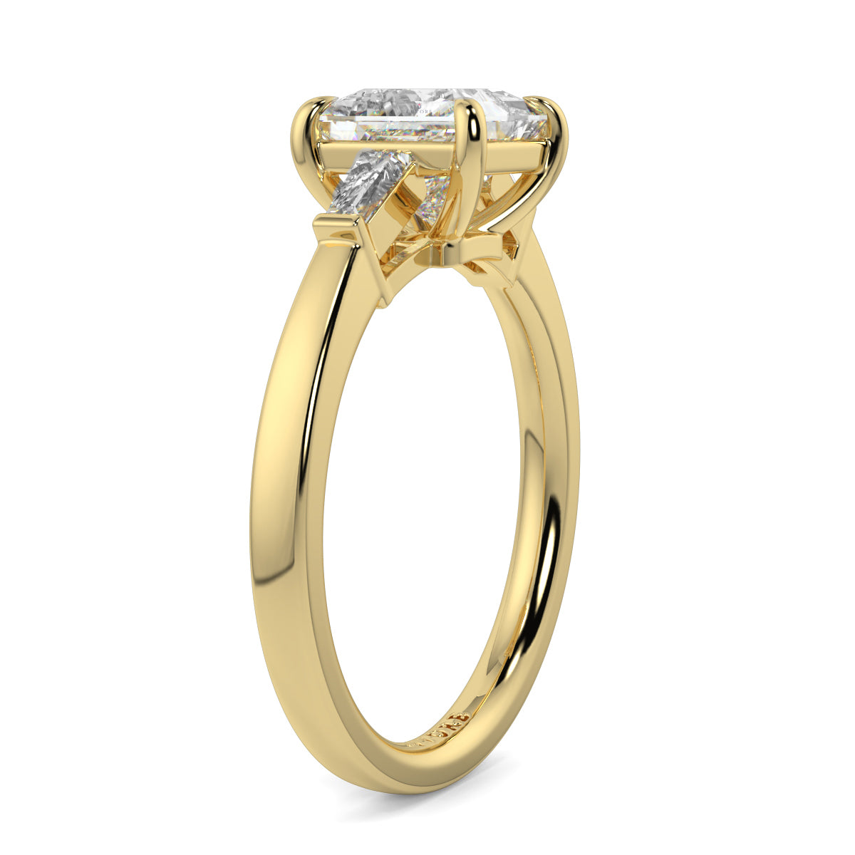 Gold ring with a diamond on a white background yb_jewellers_3_stone_trilogy_engagement_ring_round_and_pear_shape_best_selling_design_trending_diamond_ring