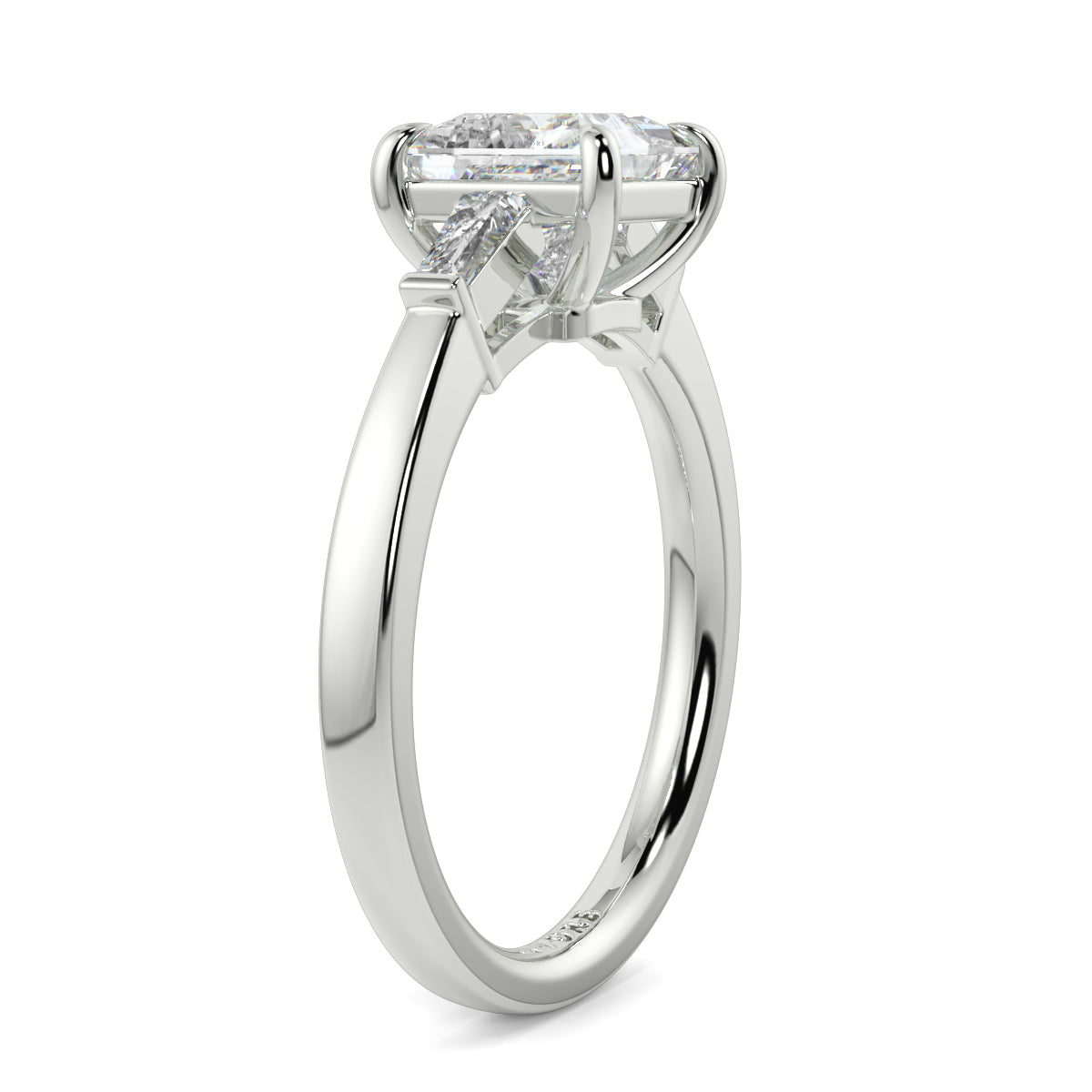 Diamond ring with a white gold band on a white background yb_jewellers_3_stone_trilogy_engagement_ring_round_and_pear_shape_best_selling_design_trending_diamond_ring