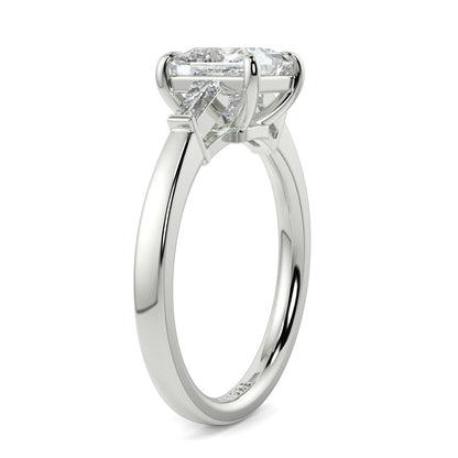 Diamond ring with a white gold band on a white background yb_jewellers_3_stone_trilogy_engagement_ring_round_and_pear_shape_best_selling_design_trending_diamond_ring