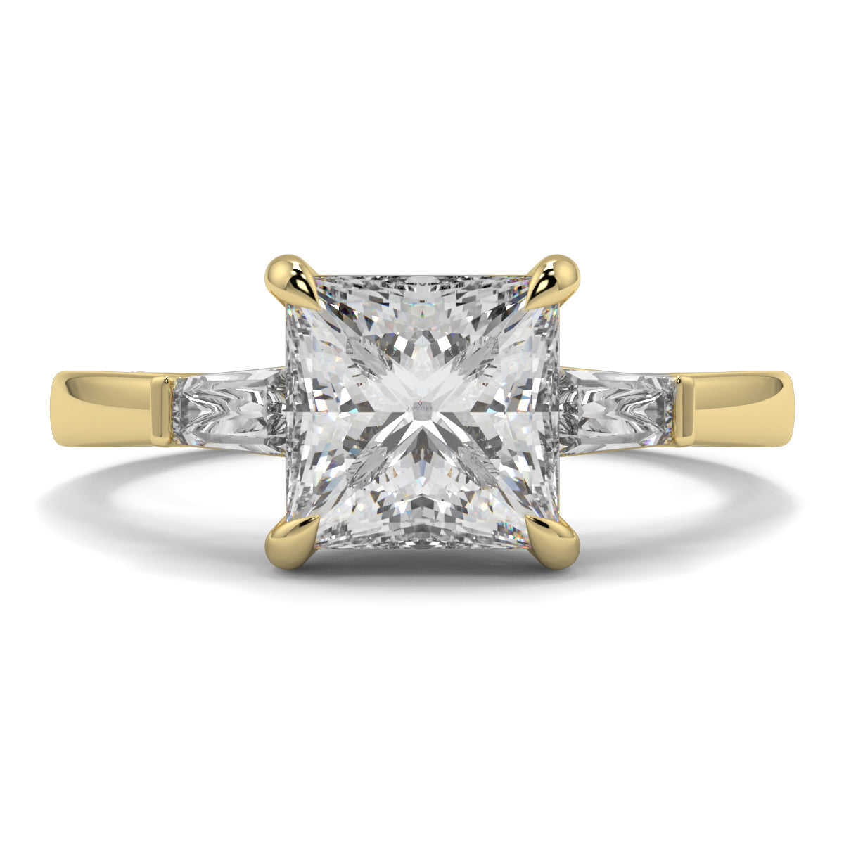 Gold ring with a large diamond on a white background yb_jewellers_3_stone_trilogy_engagement_ring_round_and_pear_shape_best_selling_design_trending_diamond_ring