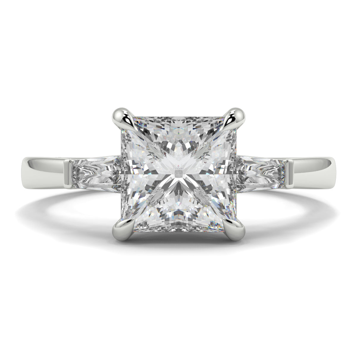 Diamond ring with a square-cut gemstone on a white background yb_jewellers_3_stone_trilogy_engagement_ring_round_and_pear_shape_best_selling_design_trending_diamond_ring