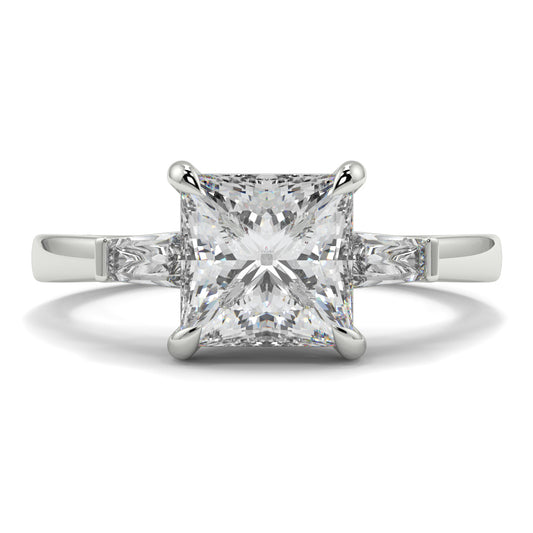 Diamond ring with a square-cut gemstone on a white background yb_jewellers_3_stone_trilogy_engagement_ring_round_and_pear_shape_best_selling_design_trending_diamond_ring