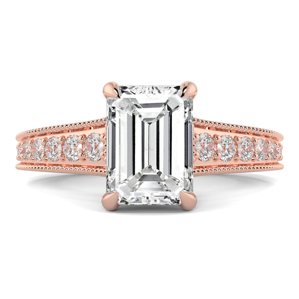 Rose gold ring with emerald-cut diamond and smaller diamonds on a white background yb jewellers platinum grain set engagement ring 