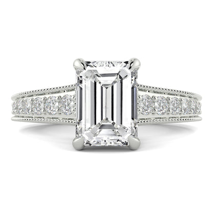 Diamond ring with emerald-cut center stone on a white background yb jewellers platinum grain set engagement ring 