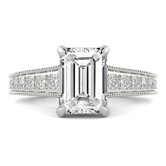 Diamond ring with emerald-cut center stone on a white background yb jewellers platinum grain set engagement ring 