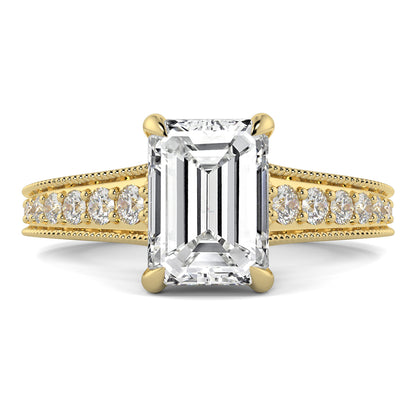 Gold ring with emerald-cut diamond and smaller diamonds on a white yb jewellers platinum grain set engagement ring background
