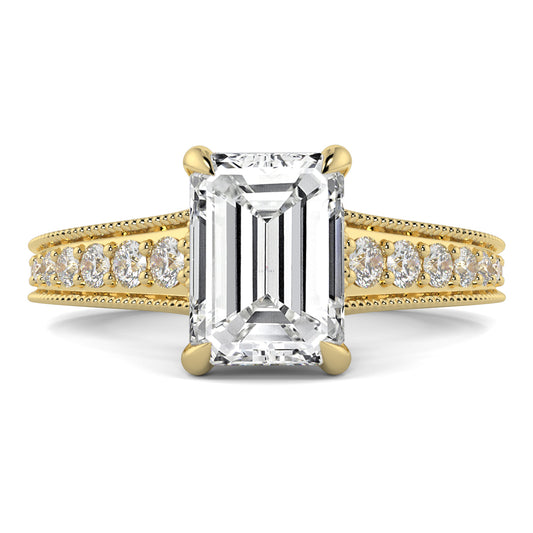 Gold ring with emerald-cut diamond and smaller diamonds on a white yb jewellers platinum grain set engagement ring background