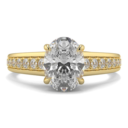 Gold ring with a large diamond and smaller diamonds on the band against a white background yb jewellers engagement ring 