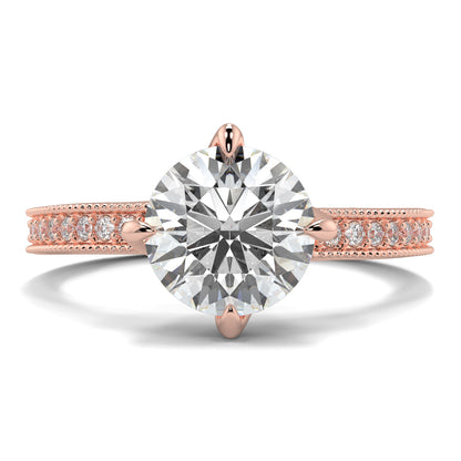 Rose gold ring with a large diamond and smaller diamonds on the band against a white background Yb jewellers engagement ring straight band