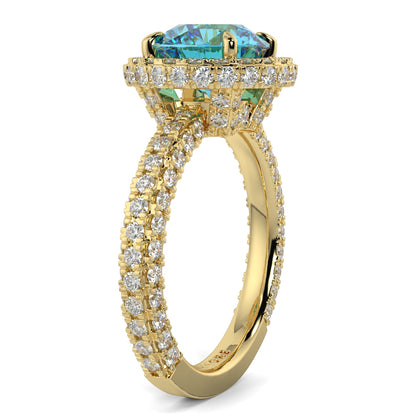 Gold ring with a blue gemstone and diamond accents on a white background yb jewellers round yellow gold halo engagement ring diamond ring